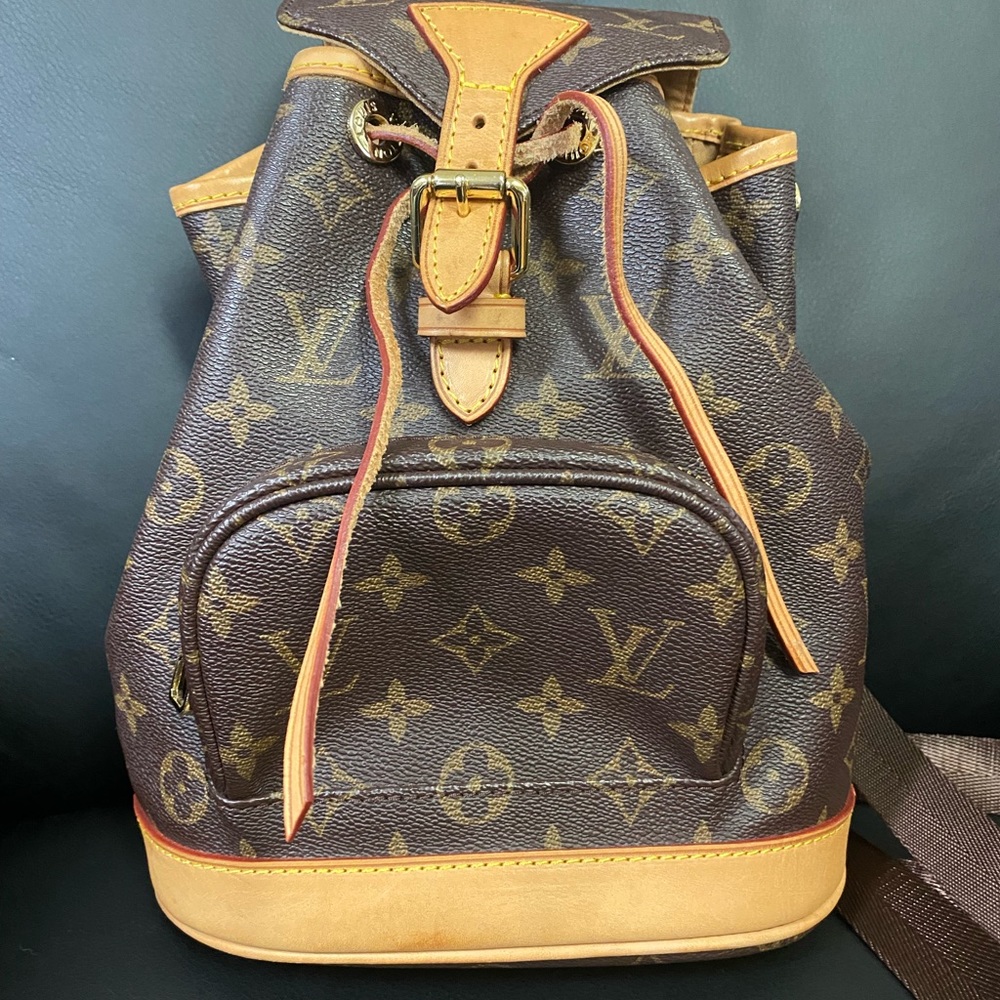 Backpack measures 9x10.5 inches . In good condition.